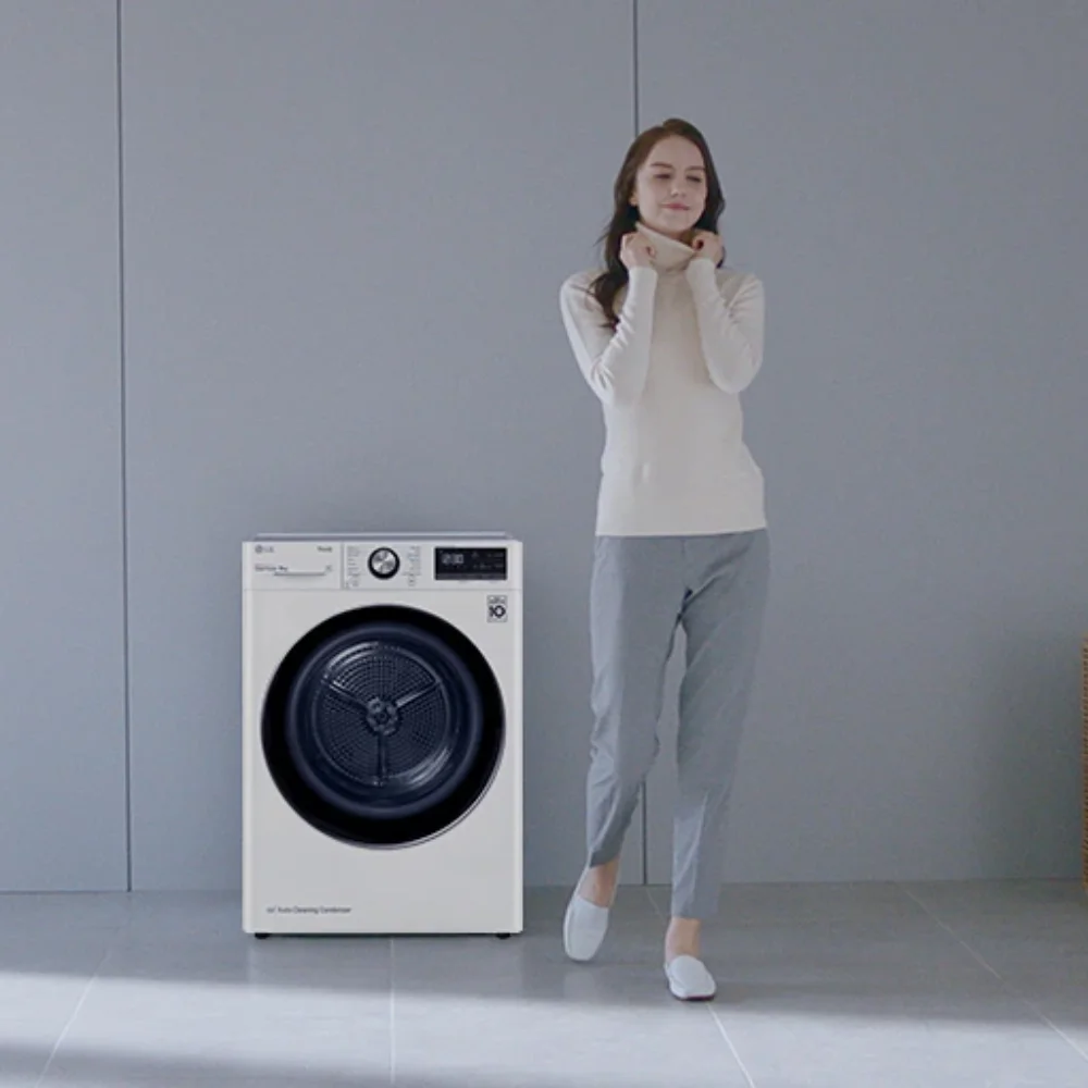 a girl standing beside the dryer